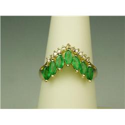 Attractive 14 karat yellow gold ladies  anniversary design ring set with 7 MQ cut  green Emeralds we