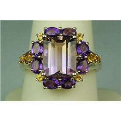 Fashionable 10 karat yellow gold ladies ring  set with a combination of Amethyst and  Citrines weigh