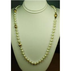 Elegant ladies strand of round cultured  Pearls averaging 5.50 mm diameter and 22  inches in length 