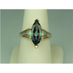 Stunning 10 karat yellow gold ladies ring set  with a center MQ cut Mystic Topaz weighing  approx. 4