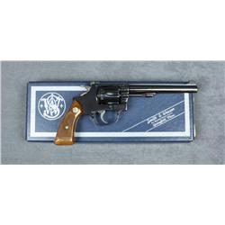 Smith & Wesson Model 35-1 DA revolver, .22LR  cal., 5-1/2” barrel, blue finish, checkered  wood meda
