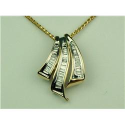 Finely crafted 14 karat yellow gold ladies  necklace channel set with over 36 baguette  cut diamonds