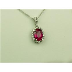 Splendid 10 karat white gold ladies pendant  set with an oval purplish red Ruby weighing  approx. 2.
