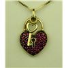 Image 1 : Charming 10 karat yellow gold ladies custom  made lock and key pendant pave set with fine  red Rubie