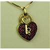 Image 2 : Charming 10 karat yellow gold ladies custom  made lock and key pendant pave set with fine  red Rubie