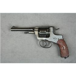 Russian Nagant DA revolver, 7.62 cal., 4-1’2”  round barrel, black finish, checkered wood  grips, #2