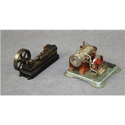 Lot of two miniature steam engine toys  including one that is approx. 7” x 8” x 5” on  a base by Jen
