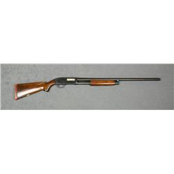 J.C. Higgins Model 20 pump action shotgun, 12  gauge, 28” barrel, blue finish, plain wood  stocks, #