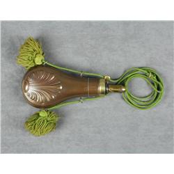 Scallop designed brass shotgun powder flask  approx. 8” overall and in fine condition with  woven ha