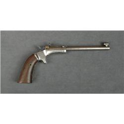 Stevens tip-up single shot pistol, .22 cal.,  6” round barrel, blue and nickel finish, wood  grips,