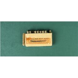 Winchester brand partial box of 9mm Mauser  Soft Point cartridges; box is fraying and  missing lid. 