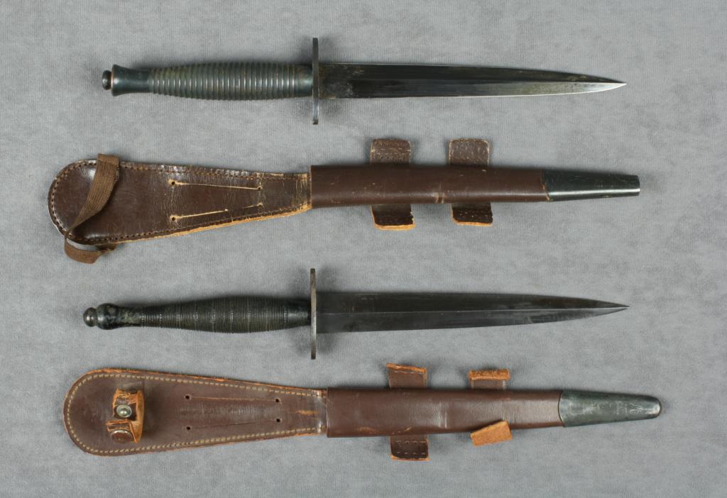 Pair of collectible British SykesFairburn military knives with leather