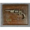 Image 1 : Relic Colt Root percussion revolver on  display board.  Est.:  $100-$200.