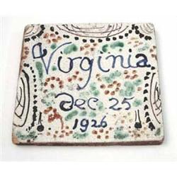 A tin-glazed earthenware tile painted in...
