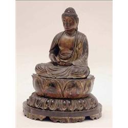 A 19th century Tibetan carved wood and gilt...