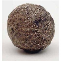 An early 20th century gutta percha golf ball...