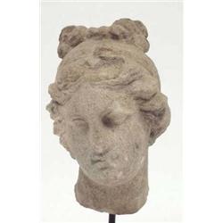 A Hellenistic carved marble bust of a girl,...