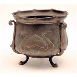 An Art Nouveau copper jardiniere embossed...