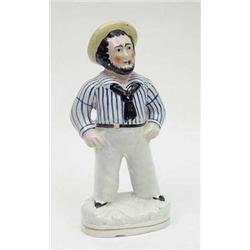A Victorian Staffordshire figure of a sailor...