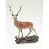 Image 1 : A Beswick figure of a stag standing on a...