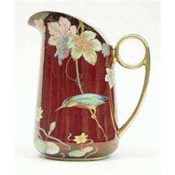 A Carltonware rouge royale water jug painted...