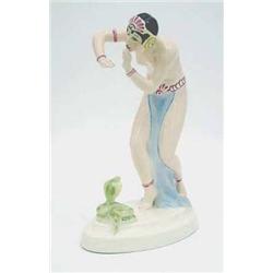 A Royal Dux figure of a female snake charmer...