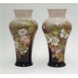 A pair of Royal Doulton faience vases...