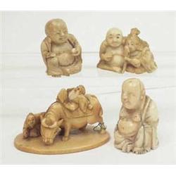 A Japanese ivory netsuke of a seated couple,...