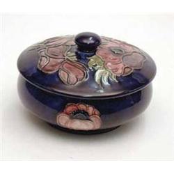 A Moorcroft circular trinket box and cover...