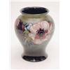 Image 1 : A Moorcroft baluster vase with anemones on a...