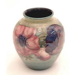 A small Moorcroft vase with anemones on a...