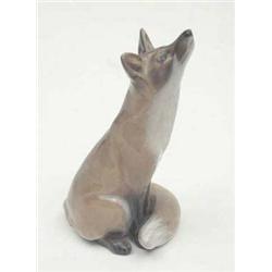 A Royal Copenhagen model of a seated fox,...