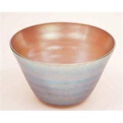 A gold and blue iridescent glass bowl,...