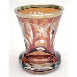 An amber flash vase with gilt rim and floral...