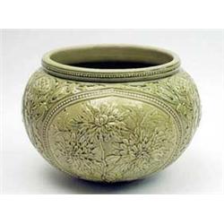 A late Victorian Burmantofts green glaze...