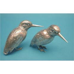 A pair of Continental silver novelty peppers...