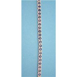 A 2-colour gold sapphire set line bracelet,...