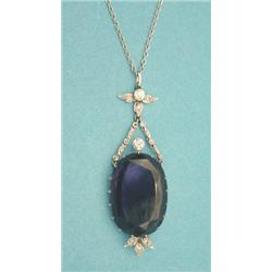 An amethyst and diamond pendant, the oval...