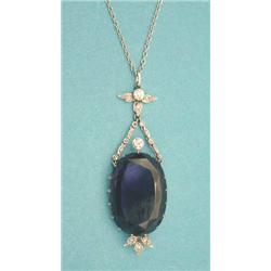 An amethyst and diamond pendant, the oval...