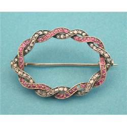 A French gold open oval brooch designed as 2...