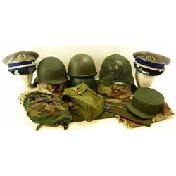 Large collection of military helmets and hats