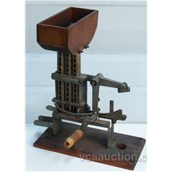 Early Countertop Hand-Crank Penny Machine,