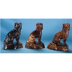 Three Staffordshire Dog Doorstops In Various Color Glazes