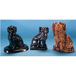 Assortment of Stoneware Dog Doorstops from the Midwest