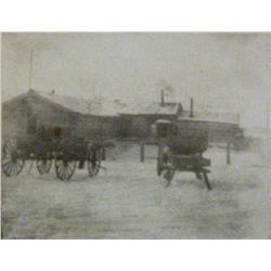 2 photographs:(1) Log Palace on 72 Ranch, Spring Creek, MT, 3 ¾” x 4 ¾”,