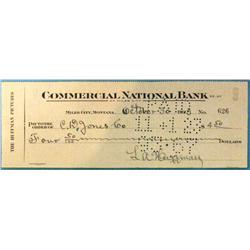L. A. Huffman signed check from Commercial National Bank