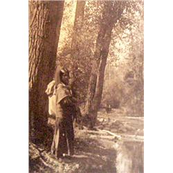 McKay, Rollin H. (1880-1965),  Indian Woman by Creek, photo,  6” x 4 ¼”, gelatin silver sepia toned.
