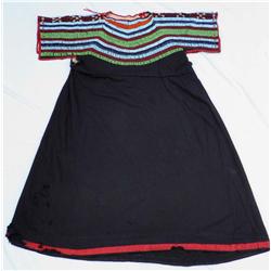 Blackfeet beaded trade cloth dress, ca. 1890’s, shows some wear and a few moth holes.