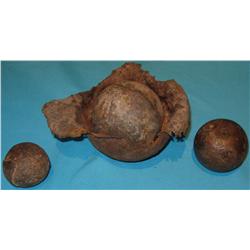 Cannon balls, 3 sizes from Ft. Keogh, M.T. plus 1 large that is fragmented from being fired.