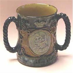 A ROYAL DOULTON STONEWARE 2 HANDLED LOVING...